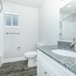 Primary bathroom in a two-bedroom apartment with modern finishes at Carlson Apartments, located in Colorado Springs, CO