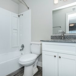 Bathroom in one bedroom apartments with modern finishes at Carlson Apartments, located in Colorado Springs, CO