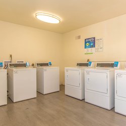 Laundry facility Leasing office interiors atThe Carlson in Colorado Springs, CO